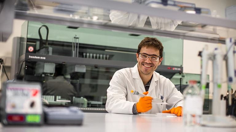 Swiss employee in a laboratory.