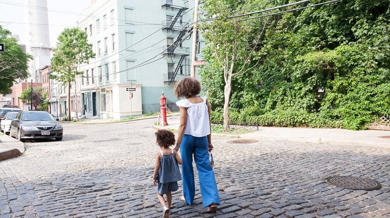 Mother and child walking on the street